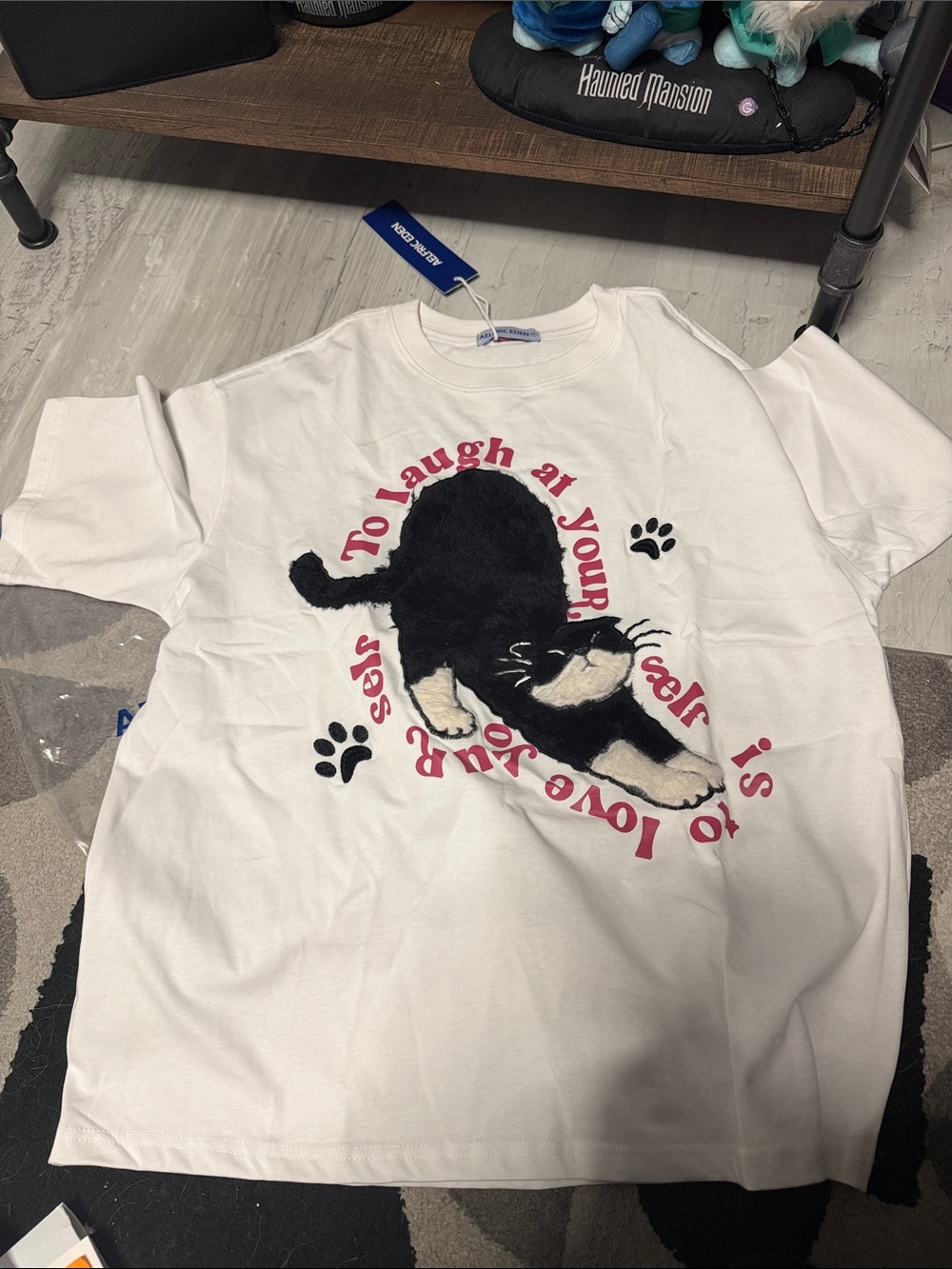 Aelfric Eden White Tee with Black Cat Graphic and Pink Text